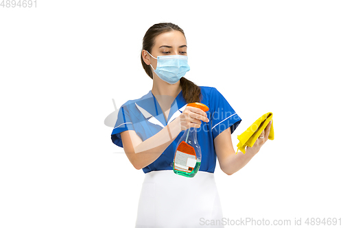 Image of Portrait of female made, cleaning worker in white and blue uniform isolated over white background