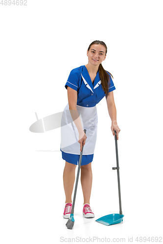 Image of Portrait of female made, cleaning worker in white and blue uniform isolated over white background