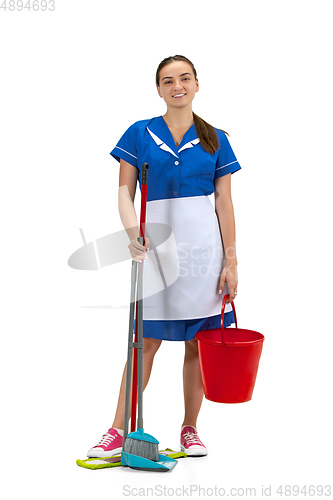 Image of Portrait of female made, cleaning worker in white and blue uniform isolated over white background