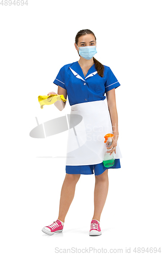 Image of Portrait of female made, cleaning worker in white and blue uniform isolated over white background