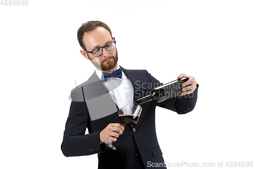 Image of Portrait of male sommelier in suit isolated over white background