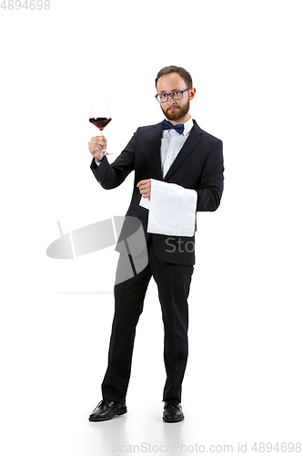 Image of Portrait of male sommelier in suit isolated over white background