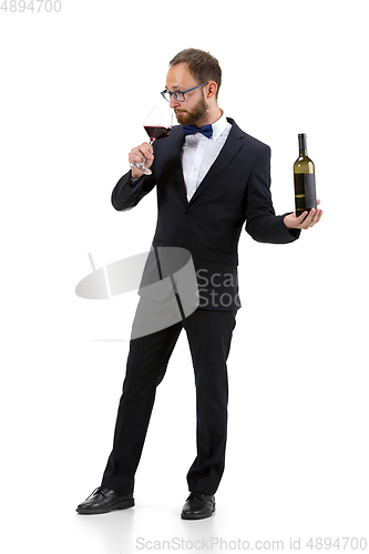 Image of Portrait of male sommelier in suit isolated over white background