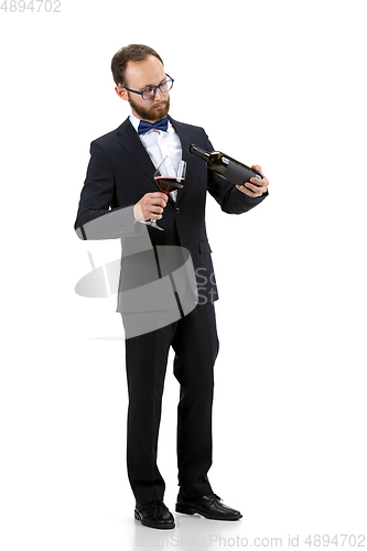 Image of Portrait of male sommelier in suit isolated over white background
