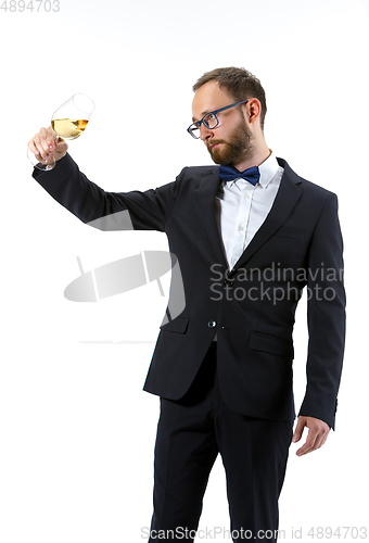 Image of Portrait of male sommelier in suit isolated over white background