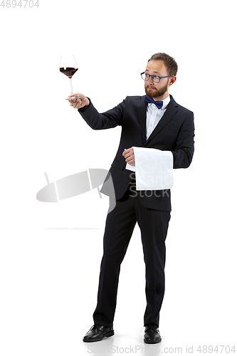 Image of Portrait of male sommelier in suit isolated over white background