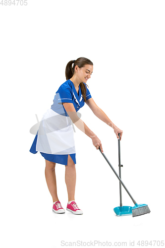 Image of Portrait of female made, cleaning worker in white and blue uniform isolated over white background