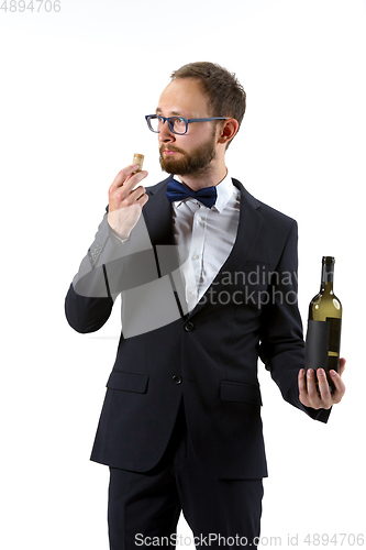 Image of Portrait of male sommelier in suit isolated over white background