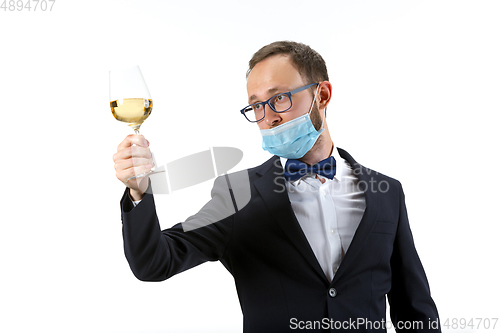 Image of Portrait of male sommelier in suit isolated over white background