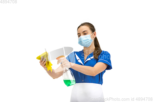 Image of Portrait of female made, cleaning worker in white and blue uniform isolated over white background