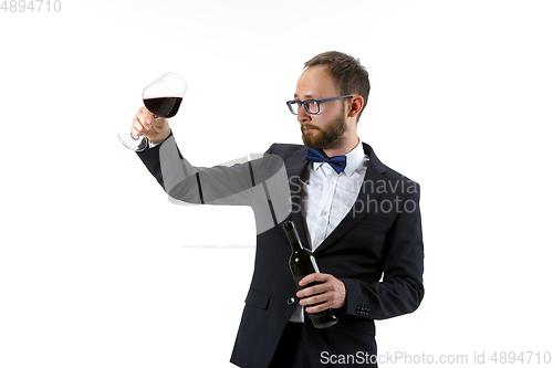 Image of Portrait of male sommelier in suit isolated over white background