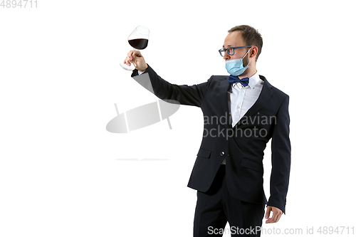 Image of Portrait of male sommelier in suit isolated over white background