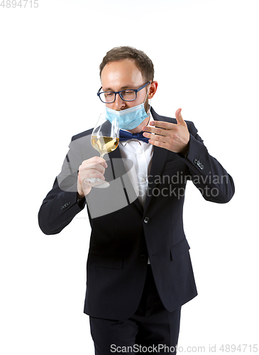 Image of Portrait of male sommelier in suit isolated over white background