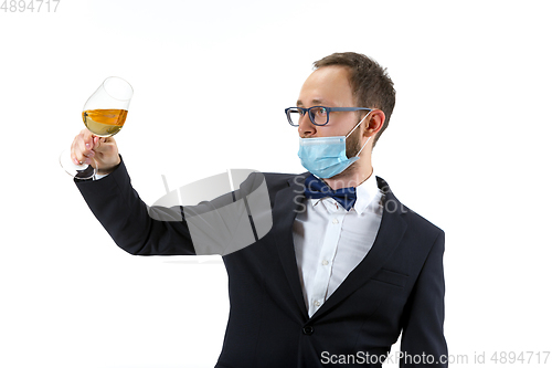 Image of Portrait of male sommelier in suit isolated over white background