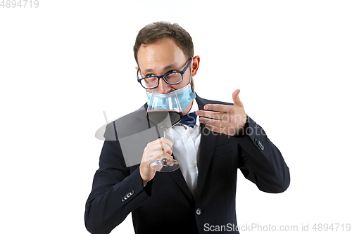 Image of Portrait of male sommelier in suit isolated over white background