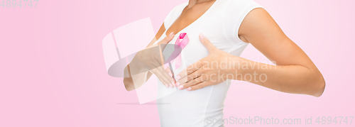 Image of woman with pink breast cancer awareness ribbon