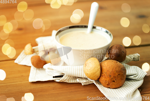 Image of mushroom cream soup in bowl on cutting board