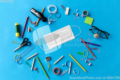 Image of stationery or school supplies and medical mask