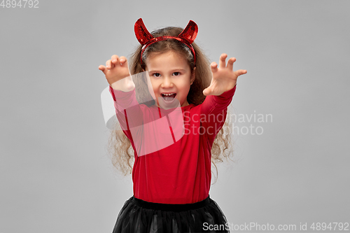 Image of girl costume with devil's horns on halloween