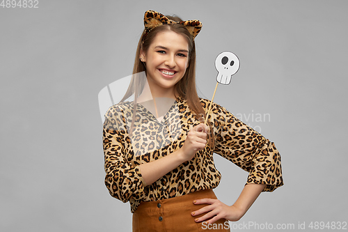 Image of happy woman in halloween costume of leopard