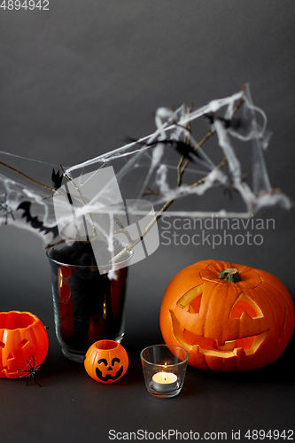 Image of pumpkins, candles and halloween decorations