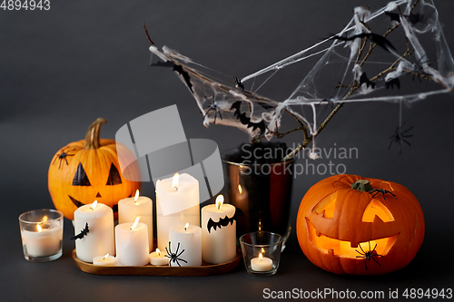 Image of pumpkins, candles and halloween decorations