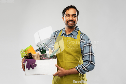 Image of indian gardener or farmer with box of garden tools