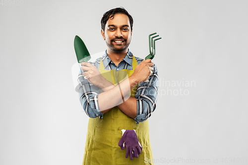 Image of indian gardener or farmer with box of garden tools