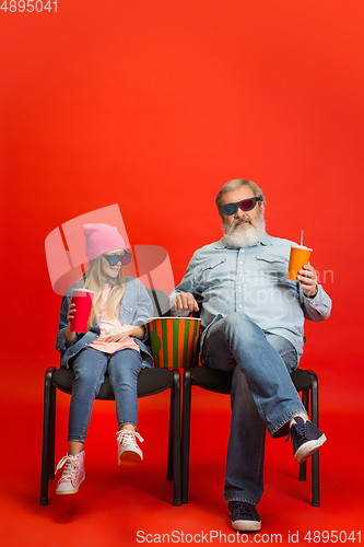 Image of Senior man, grandfather having fun and spending time together with girl, granddaughter. Joyful elderly lifestyle concept