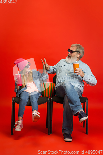 Image of Senior man, grandfather having fun and spending time together with girl, granddaughter. Joyful elderly lifestyle concept