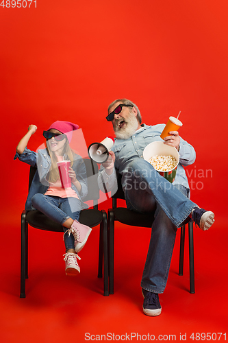 Image of Senior man, grandfather having fun and spending time together with girl, granddaughter. Joyful elderly lifestyle concept