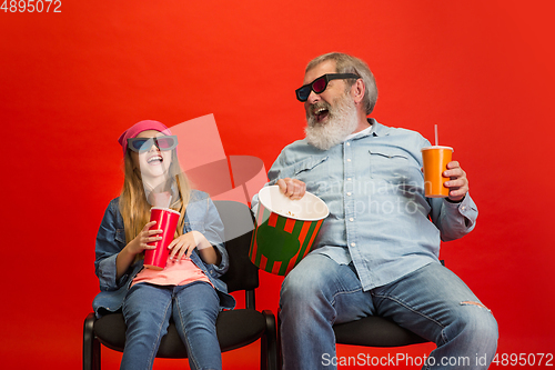 Image of Senior man, grandfather having fun and spending time together with girl, granddaughter. Joyful elderly lifestyle concept