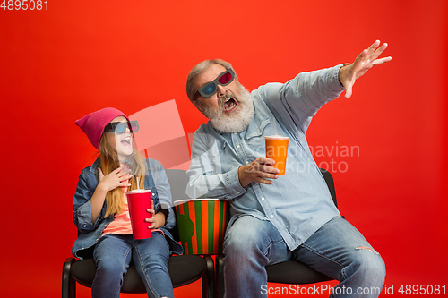 Image of Senior man, grandfather having fun and spending time together with girl, granddaughter. Joyful elderly lifestyle concept