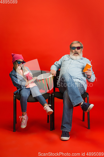 Image of Senior man, grandfather having fun and spending time together with girl, granddaughter. Joyful elderly lifestyle concept