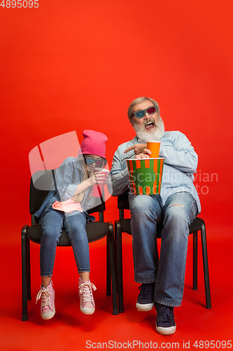 Image of Senior man, grandfather having fun and spending time together with girl, granddaughter. Joyful elderly lifestyle concept