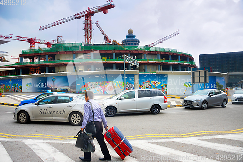 Image of Man luggage airport construction Singapore