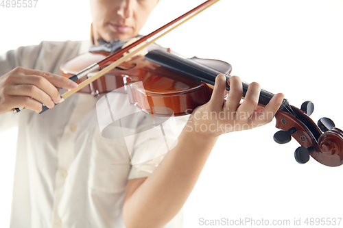 Image of Close up woman playing violin isolated on white studio background