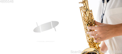 Image of Close up woman playing saxophone isolated on white studio background