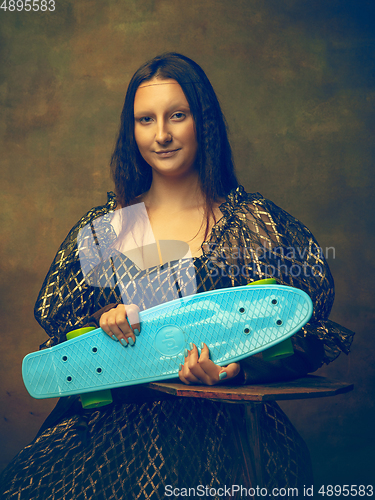 Image of Young woman as Mona Lisa on dark background. Retro style, comparison of eras concept.