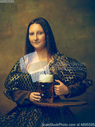 Image of Young woman as Mona Lisa on dark background. Retro style, comparison of eras concept.