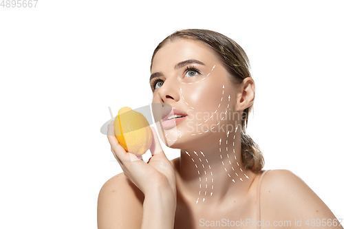 Image of Youth secrets. Beautiful young woman over white background. Cosmetics and makeup, lifting and aging concept.