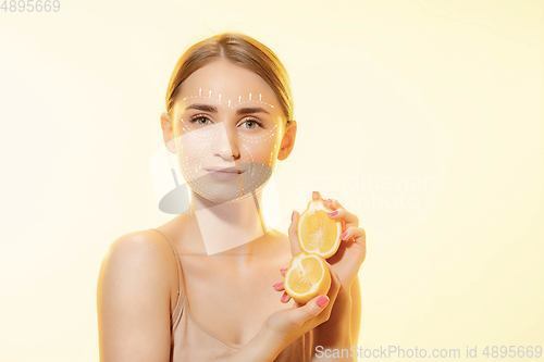 Image of Youth secrets. Beautiful young woman over white background. Cosmetics and makeup, lifting and aging concept.