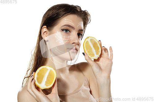 Image of Youth secrets. Beautiful young woman over white background. Cosmetics and makeup, lifting and aging concept.