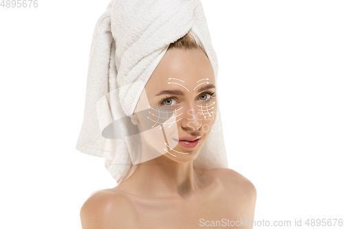 Image of Youth secrets. Beautiful young woman over white background. Cosmetics and makeup, lifting and aging concept.