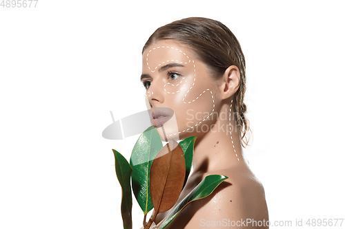 Image of Youth secrets. Beautiful young woman over white background. Cosmetics and makeup, lifting and aging concept.