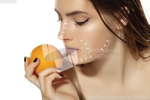 Image of Youth secrets. Beautiful young woman over white background. Cosmetics and makeup, lifting and aging concept.