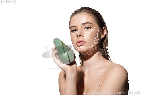 Image of Youth secrets. Beautiful young woman over white background. Cosmetics and makeup, lifting and aging concept.