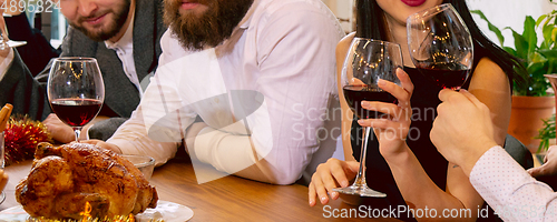 Image of Hands of young friends, colleagues during beer drinking, having fun, laughting and celebrating together. Flyer with copyspace