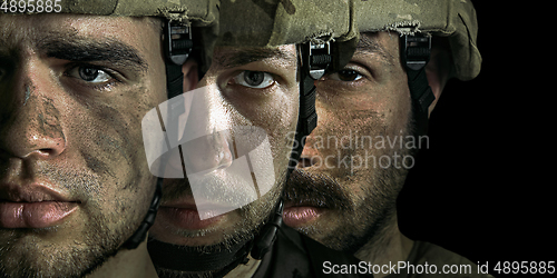 Image of Close up portrait of young male soldiers. Men in military uniform on the war, flyer