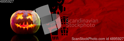 Image of Scary pumpkin on red and black background, the night of fear